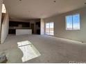 Bright and airy living room with large windows and access to a deck at 393 Grey Rock St, Brighton, CO 80601