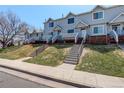 Desirable townhomes with inviting stairs, beautiful landscaping, and a friendly neighborhood ambiance at 4120 E 119Th Pl # B, Thornton, CO 80233