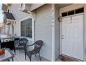 Cozy front porch featuring a grill, seating, and a welcoming entrance to the home at 4120 E 119Th Pl # B, Thornton, CO 80233