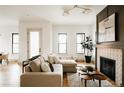 Comfortable living room featuring a stylish fireplace and modern decor at 1016 28Th St, Denver, CO 80205