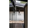 Entryway with mirrored wall, gravel accents and modern address plaque on the house at 3605 W Berry Ave, Littleton, CO 80123