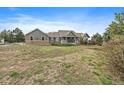 Inviting home with a covered front porch and brick accents, set on a sprawling lot at 3342 Quail Ridge Cir, Parker, CO 80138