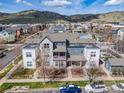 Stunning aerial view of the home showcasing its location and neighborhood with mountain views in the background at 1495 Zamia Ave # 3, Boulder, CO 80304
