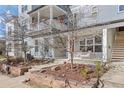 Inviting home exterior featuring a cozy front porch and professionally landscaped front yard in a desirable neighborhood at 1495 Zamia Ave # 3, Boulder, CO 80304
