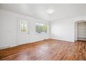 Inviting living room with stylish hardwood floors and bright, fresh paint at 4624 S Lincoln St, Englewood, CO 80113