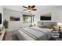 Cozy bedroom featuring a large window, ceiling fan, and neutral decor for a tranquil feel at 420 Dudley St, Lakewood, CO 80226