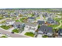 Sprawling neighborhood featuring numerous homes, green spaces, and community parks at 6679 Kenzie Cir, Castle Pines, CO 80108