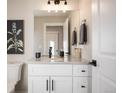 Elegant half bathroom features a white vanity with a light countertop and modern fixtures at 4341 N Columbine St, Denver, CO 80216