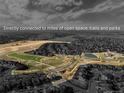 Aerial view showcases the home's connection to extensive open space, trails, and parks at 90 Moonrise Ct, Erie, CO 80516