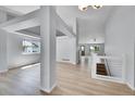Bright living space with wood floors, an open floor plan, and modern lighting at 2205 Santa Fe Dr, Longmont, CO 80504