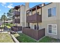 Apartment balconies showcase a rustic-style wooden railing that provide a private outdoor living space at 9725 E Harvard Ave # 305, Denver, CO 80231