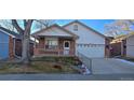 Cute ranch home with a well-maintained lawn at 6567 Pierson St, Arvada, CO 80004