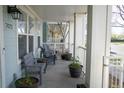 Relaxing front porch with comfortable seating and decorative potted plants at 7472 E 28Th Ave, Denver, CO 80238