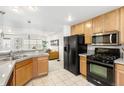 Well-equipped kitchen with modern black appliances and ample cabinet space at 4395 E Jewell Ave # 3, Denver, CO 80222
