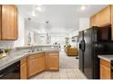 Open-concept kitchen with stainless steel appliances seamlessly connects to the living area at 4395 E Jewell Ave # 3, Denver, CO 80222
