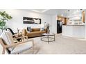 Bright living room features modern decor, stylish furnishings, and neutral tones at 4395 E Jewell Ave # 3, Denver, CO 80222