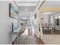 Inviting foyer with hardwood floors, an elegant staircase, and views into adjacent living spaces at 19197 E Progress Ave, Centennial, CO 80015