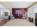 Cozy living room with plush carpet, large windows, and neutral tones at 19197 E Progress Ave, Centennial, CO 80015