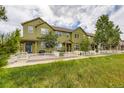 Exterior view shows a multi-story home featuring a green lawn and white picket fence at 3578 Tranquility Trl, Castle Rock, CO 80109