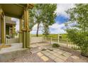 Charming front yard with a white picket fence and view of open pasture at 3578 Tranquility Trl, Castle Rock, CO 80109