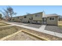 Charming townhome exterior with neat gravel landscaping and walkways on a sunny day at 5771 W 92Nd Ave # 335, Westminster, CO 80031