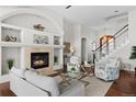 Cozy living room boasts a fireplace, with plush seating, and elegant decor, perfect for relaxation at 3074 Castle Butte Dr, Castle Rock, CO 80109