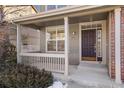 Inviting front porch with a double door entry and railing at 12454 Knox Ct, Broomfield, CO 80020