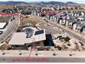Aerial view of community amenities including pool, playground and fitness facility with mountain backdrop at 15818 W 95Th Ave, Arvada, CO 80007