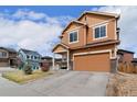 Two story home with two car garage, covered porch and xeriscaped front yard at 3081 Youngheart Way, Castle Rock, CO 80109