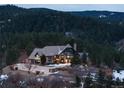 Secluded estate nestled amongst towering pine trees providing privacy and scenic views at 7225 Box Canyon Rd, Sedalia, CO 80135