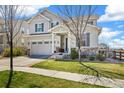 Charming two-story home boasts beautiful stone accents, a well-manicured lawn, and a two-car garage at 24222 E Canyon Pl, Aurora, CO 80016