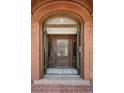 Inviting entryway showcasing a beautiful wood door and decorative mosaic tile flooring at 685 N Emerson St, Denver, CO 80218