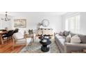 Inviting living area with neutral tones, modern furniture, and ample natural light at 6982 Estes Dr, Arvada, CO 80004