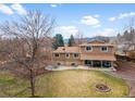 Expansive backyard with a large patio area perfect for outdoor entertaining at 7604 S Lamar Ct, Littleton, CO 80128