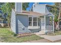Inviting home exterior featuring a bay window, front porch, and garden bed at 8168 Washington St # 46, Denver, CO 80229