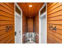 Modern stairwell with wood ceilings and metal railings leading to upper units at 2640 Central Ct # 204, Denver, CO 80211