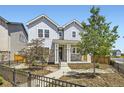Inviting two-story home with a charming front porch and meticulously maintained landscaping at 9111 W 100Th Way, Broomfield, CO 80021