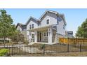 Beautiful two-story home with manicured landscaping, fenced yard, and a welcoming front porch at 9111 W 100Th Way, Westminster, CO 80021