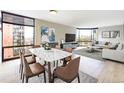 Spacious living room with large windows and contemporary furnishings at 1625 Larimer St # 1001, Denver, CO 80202