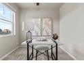 Cozy office features a modern desk, stylish lamp, and decorative artwork at 18014 Tree Sparrow Ave, Parker, CO 80134