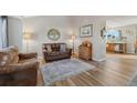 Cozy living room with hardwood floors, comfortable seating, and lots of natural light at 180 S Carlton St, Castle Rock, CO 80104