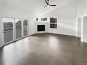 Spacious open floor plan featuring abundant natural light and a modern fireplace at 6400 N Windfield Ave, Parker, CO 80134