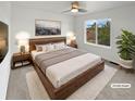 Inviting main bedroom with a king-size bed and a scenic view from a large bright window at 6400 N Windfield Ave, Parker, CO 80134