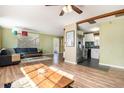 Bright, open-concept living space seamlessly flows into the kitchen area at 3350 S Forest St, Denver, CO 80222