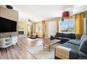 Spacious living room with hardwood floors, modern fireplace, and abundant natural light at 3350 S Forest St, Denver, CO 80222