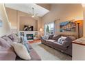 Bright and airy living room with a fireplace and comfortable seating area at 3780 S Quemoy Way, Aurora, CO 80018