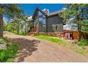 Charming two-story home with beautiful views and mature landscaping at 14980 Elk Mountain Trl, Littleton, CO 80127