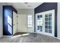 Bright entryway featuring neutral walls, carpet flooring, and natural light at 152 Pelican Ave, Brighton, CO 80601