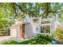 Beautiful home with brick accents, large windows, and lush landscaping for curb appeal at 15963 Rock Crystal Dr, Parker, CO 80134