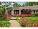Charming home exterior featuring a stone facade, well-manicured landscaping, and a welcoming front entrance at 5340 S Logan Dr, Greenwood Village, CO 80121